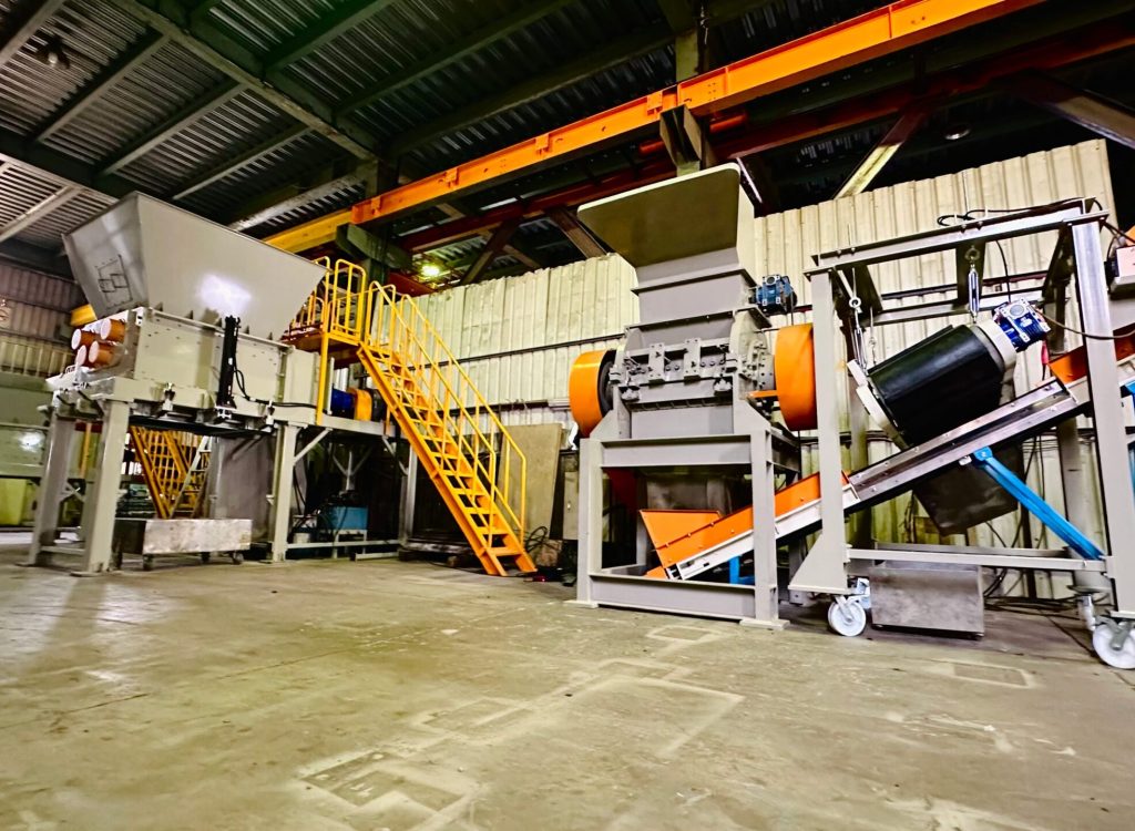 Recycling equipment on display inside Yung Hsing Machinery's factory floor